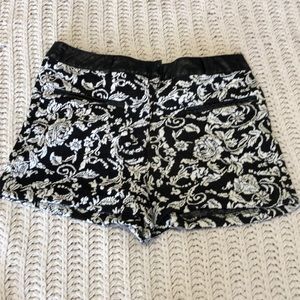 Black & white patterned shorts w/ leather accents